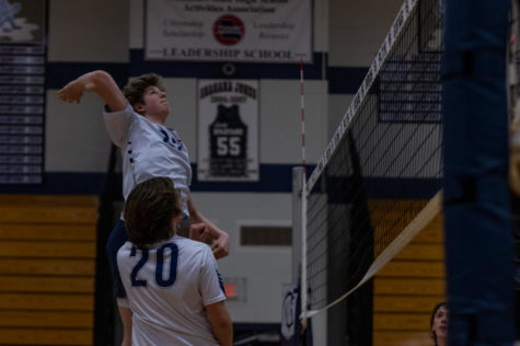 Levi Brimm aims for the 5 spot on the court, aiming to get the kill. 