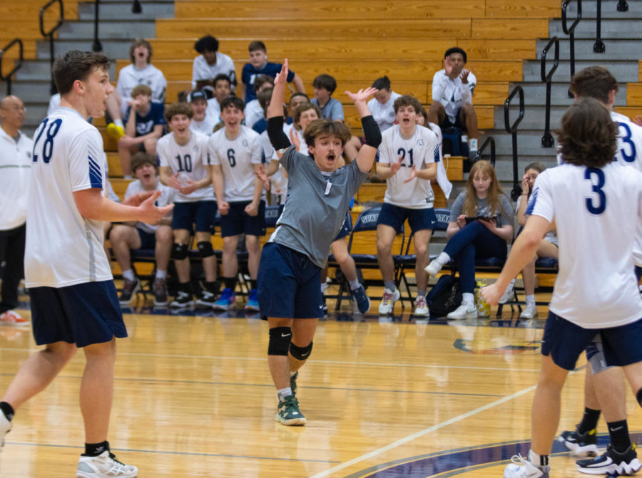 Braden Harton dances in excitement after the team scores a point.