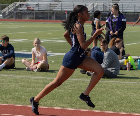 Sophomore Essence Sabree runs first in the 100-meter race.