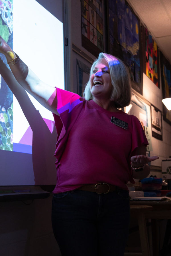 AP Art History teacher Michelle McCune gestures toward her white board. Mrs. McCune is the sponsor of NAHS and the head of the Fine Arts department. 