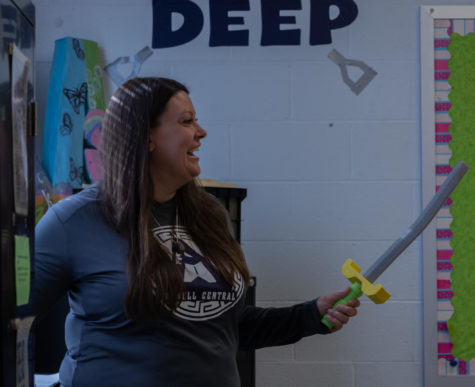 Mrs. Bulva having fun with her students as she swings a foam sword. Photo by Samantha Castille
