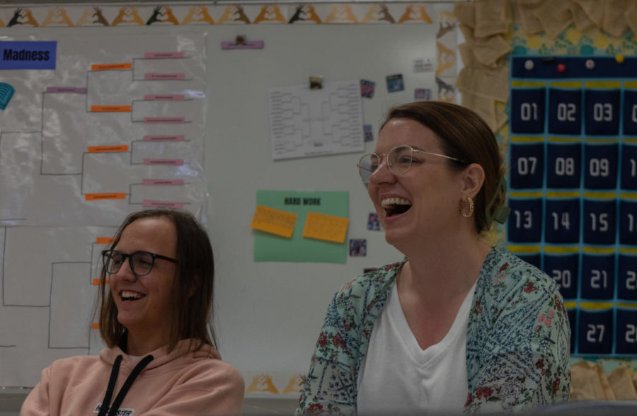 Laughing during a discussion in AP Lit, Mrs. Sarah LaRue and Nathen David enjoy a light moment. 