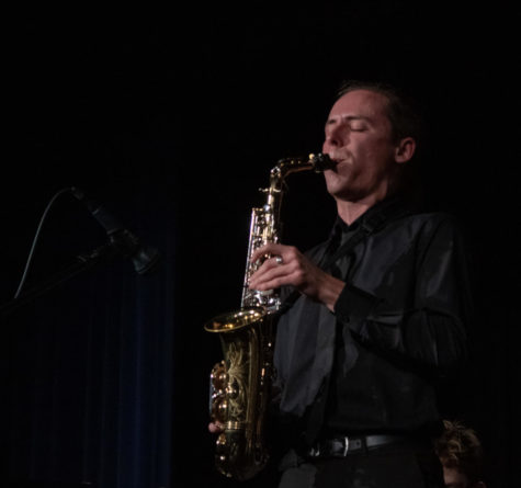 Caden Scott plays his feature on the saxophone.