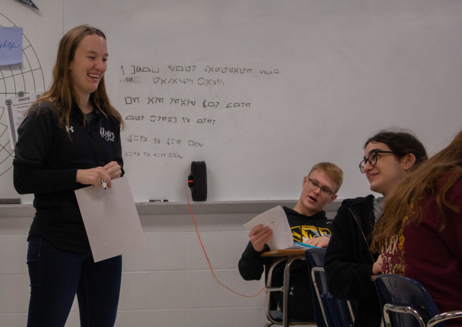 Ms. Fischer enjoys a light moment with her third hour students. 