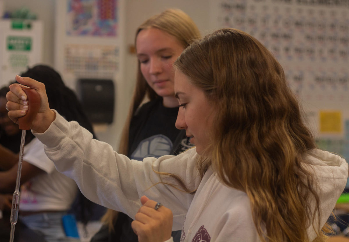 Senior Abby OBrien participates in a density lab during Mrs. Melissa Broadfields 4th hour chemistry class on Sept. 19. During this period students visually observe how different substances have different densities. 