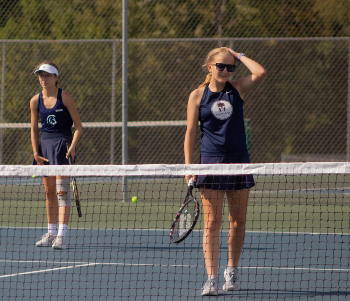 Sophie Rosser and Rachel Latzel shake off a bad point in their match against Timberland High School. The duo pushed through and won their match 6-4 on Sept. 12.