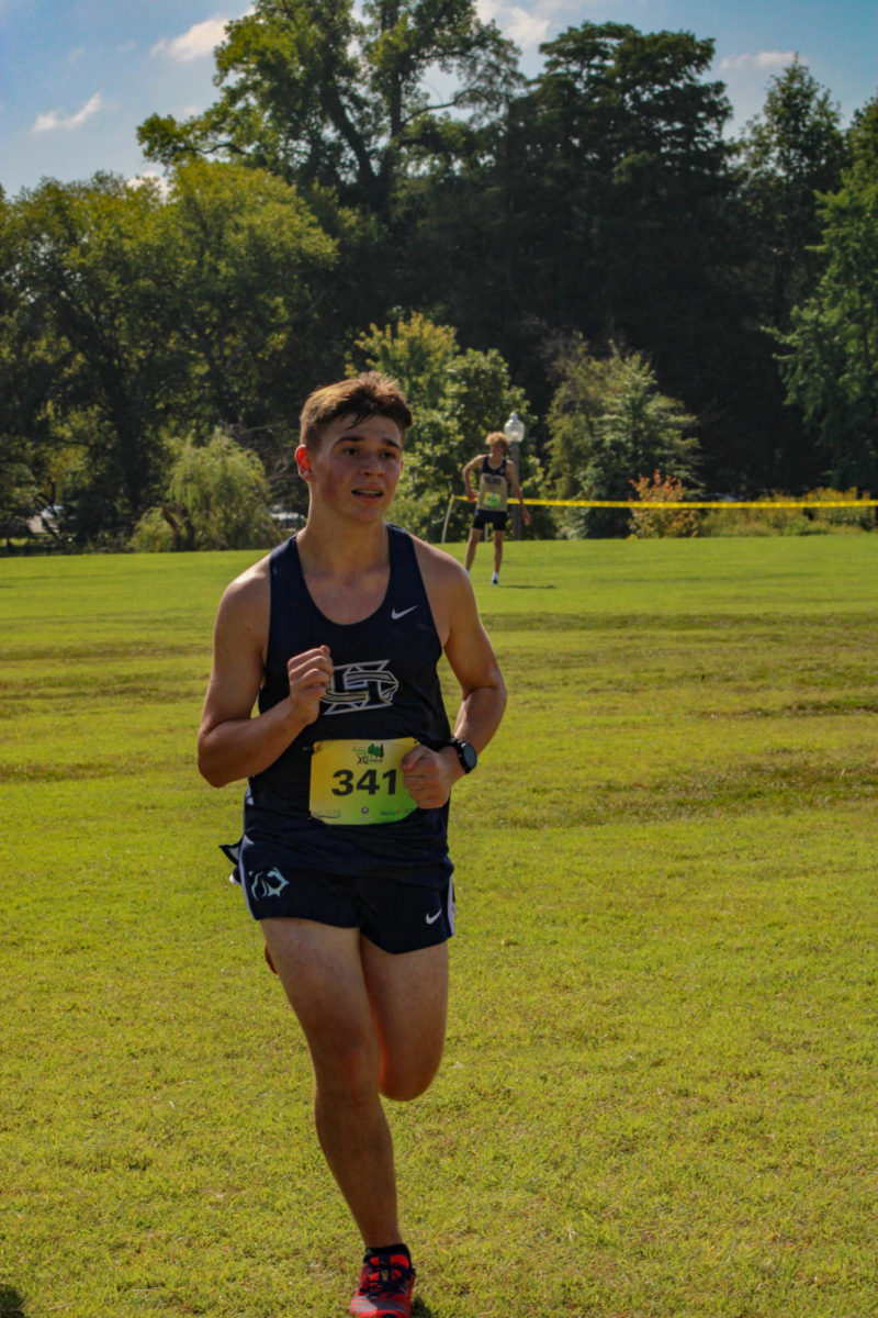 Sophomore Ian Harting picks up the pace as he stares down the finish