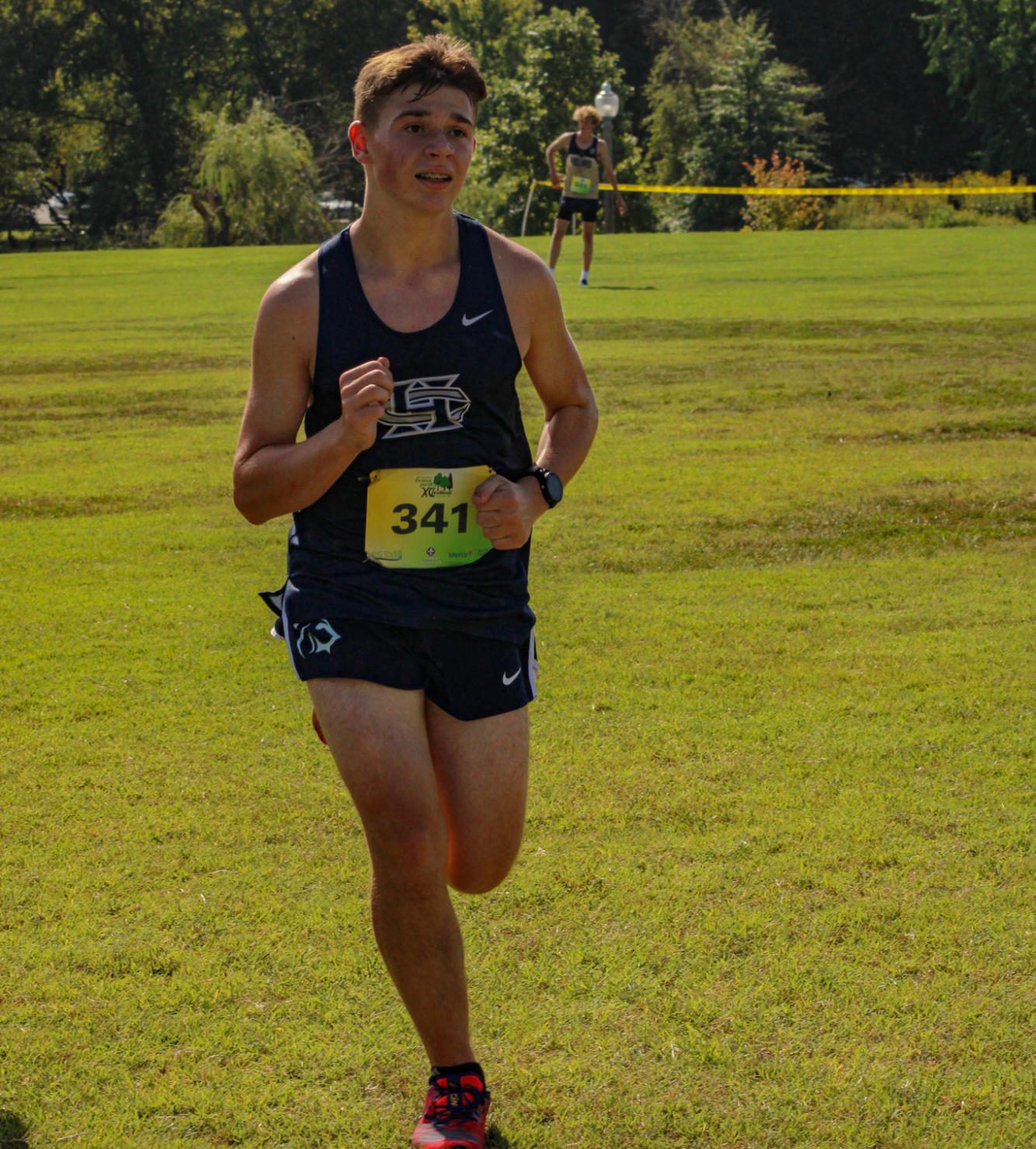 Sophomore Ian Harting picks up the pace as he stares down the finish line.