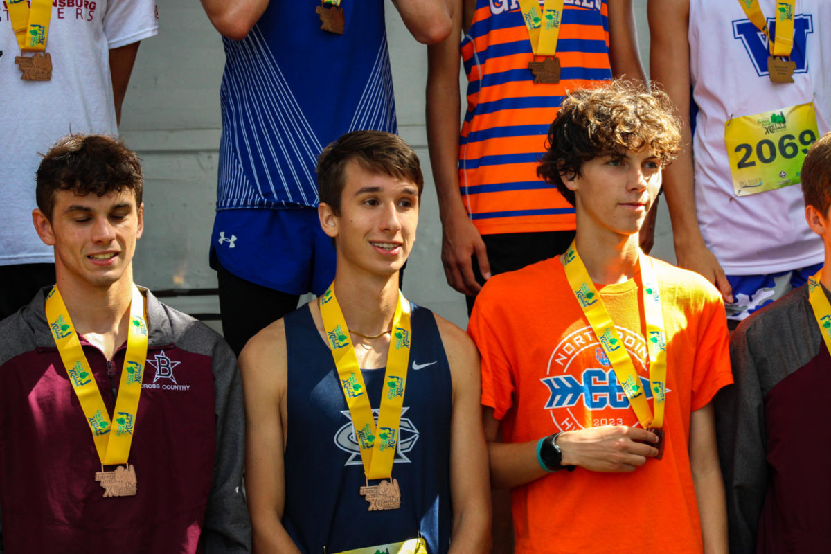 Senior Ezra Bailey after receiving his medal, placing 22nd in the boys gold division.