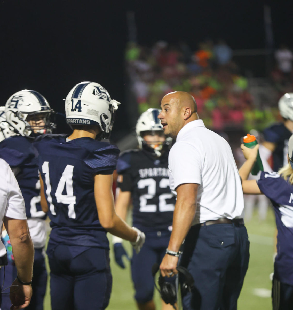 Coach+Malach+Radigan+coaches+Junior+Grayson+Graham+during+a+football+game+against+Fort+Zumwalt+South.+This+year+will+be+Coach+Radigans+third+year+as+head+football+coach+at+Francis+Howell+Central.
