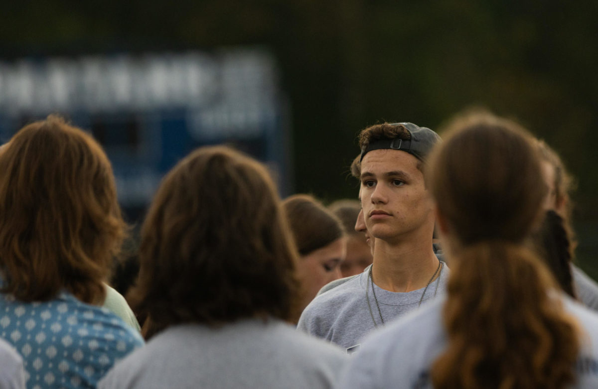 Senior drum major Sean Latta watches the band as they listen to their instructions for the upcoming pitch warm up. Latta and his partner, senior Tony Valera, conduct the band and helped lead the practice for former band director Richard Saucedo on Oct. 4.