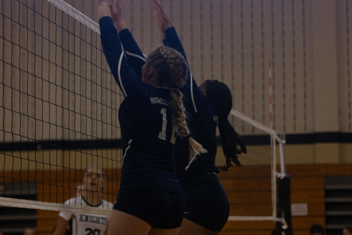 Chloe Horton and Kortnee Ware jump up for the block, anxious to put the ball back on the opposing teams side.