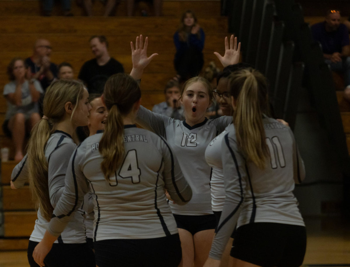 Chloe Horton cheers with her teammates after making the play that gave them an advantage over Troy.