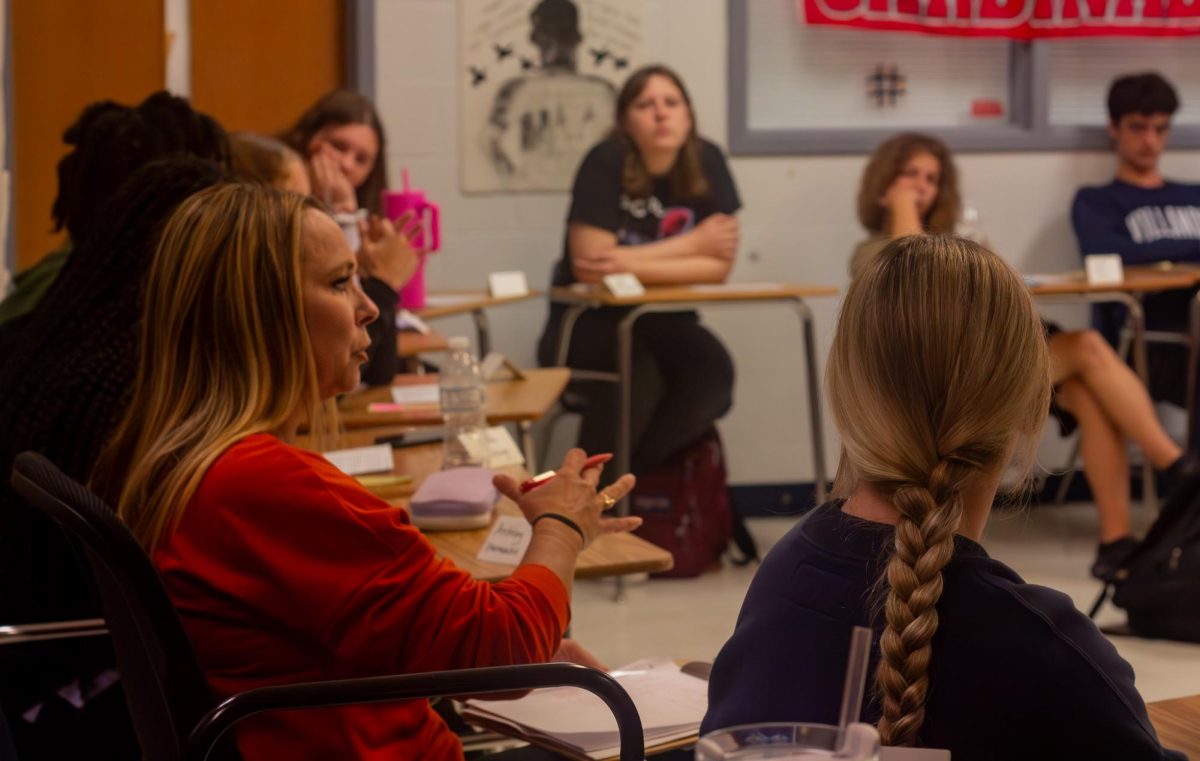 Ms. Fay talks to the class while in the discussion circle for the book, “The Catcher in the Rye”.