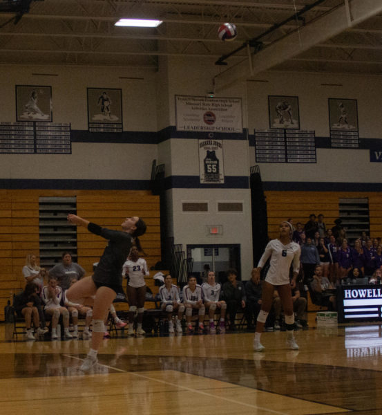 Fort Zumwalt West bumps the ball over the net, with FHCs girls working to send it back