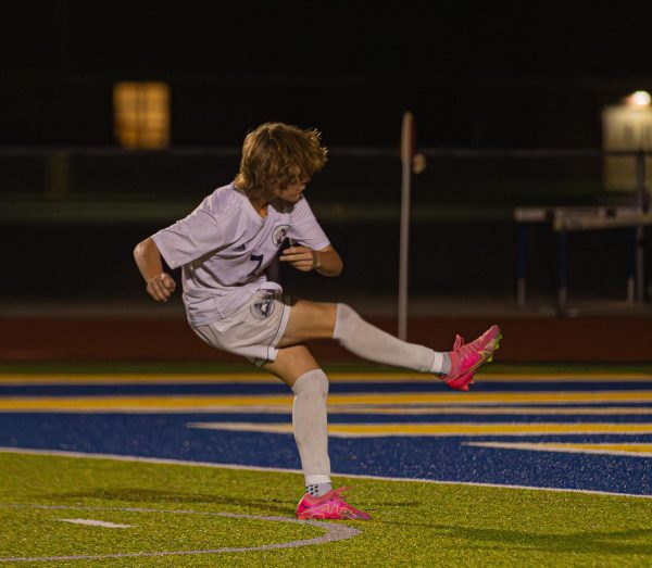 Freshman Louis Troha taking a penalty kick after going into overtime. He continues to score a point for the team.