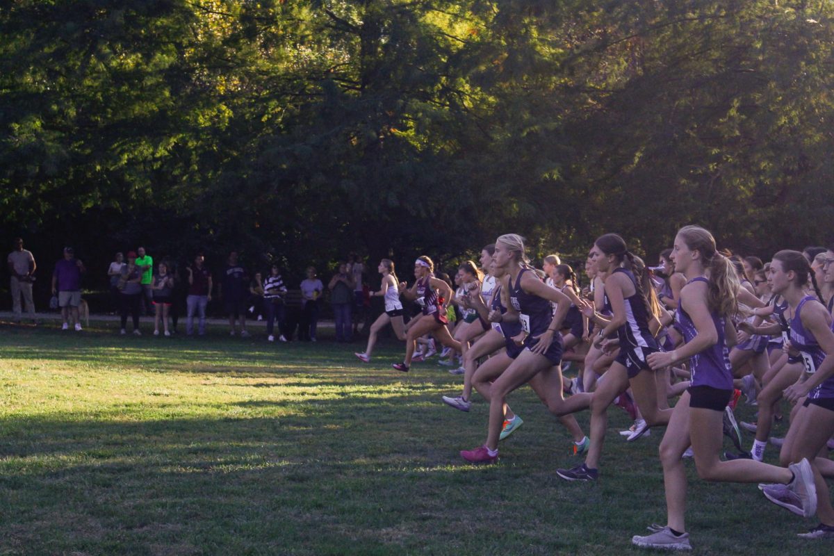 At the sound of the shot, the girls team starts their race, eager to give it their all.