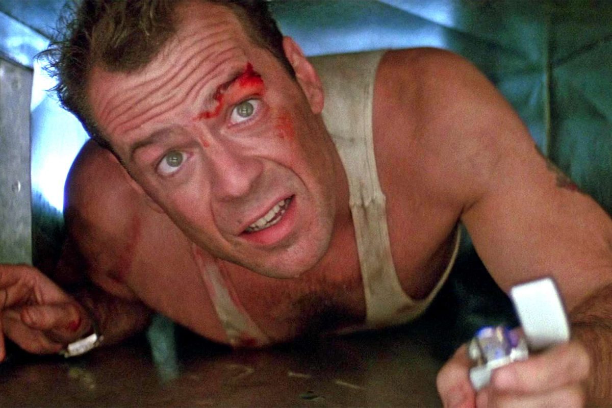 John McClain crawls though an air vent like Santa Claus as he avoids bullets from below. Photo courtesy of Entertainment Weekly