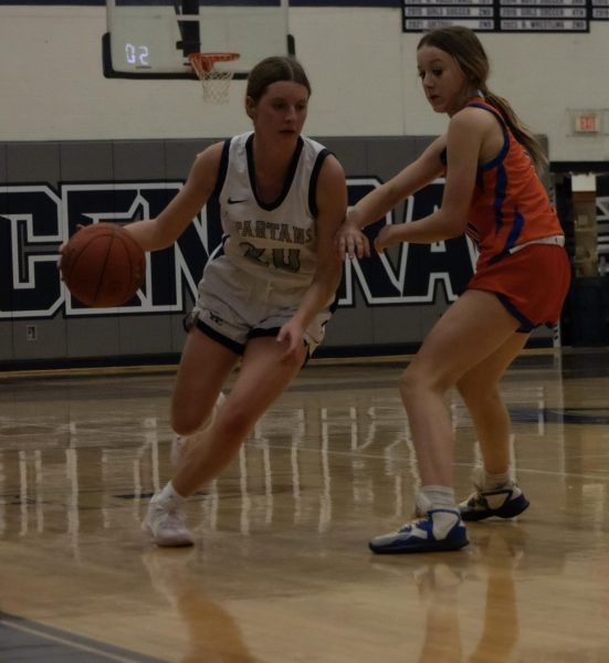 Sophomore Sam Taylor dribbles the basketball past an opponent to attempt to make a pass to a teammate. This was the girls first game against North Point on Friday, Dec 1.