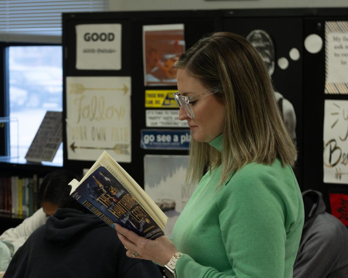 Mrs. Lentz reading her book during SSR time. Her classroom is a breath of fresh air, and a safe, quiet place for all who enter. 