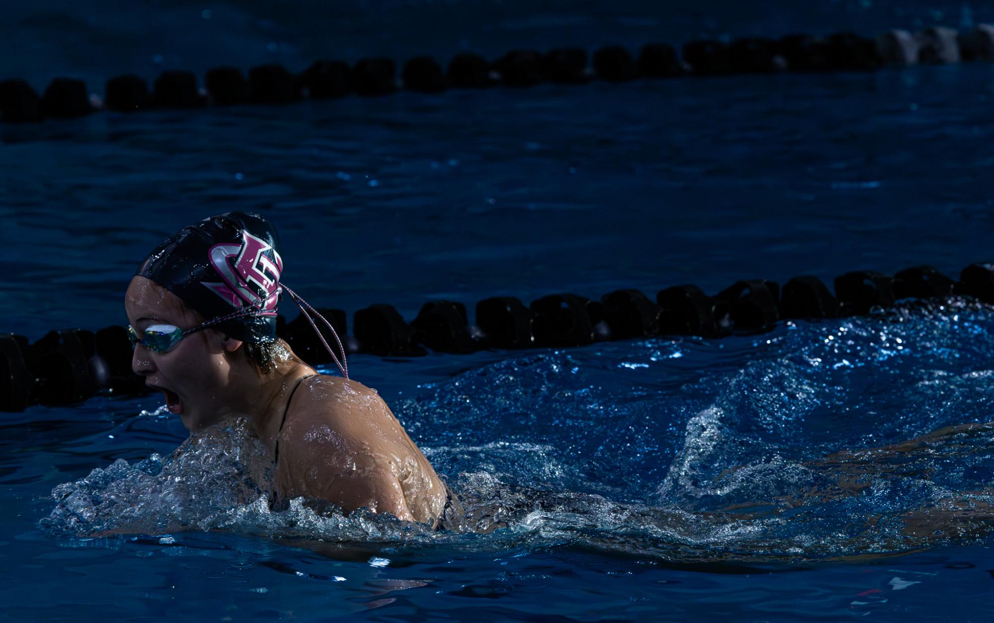 In an intense race on Dec. 15 sophomore Katie Wuertz comes up for breath while swimming the breaststroke.