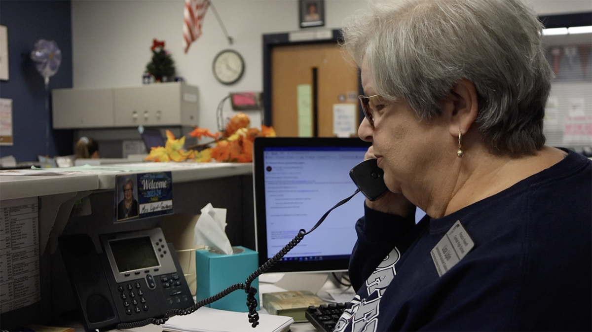Guidance Secretary, Ms. Lipin answers phone a call. 