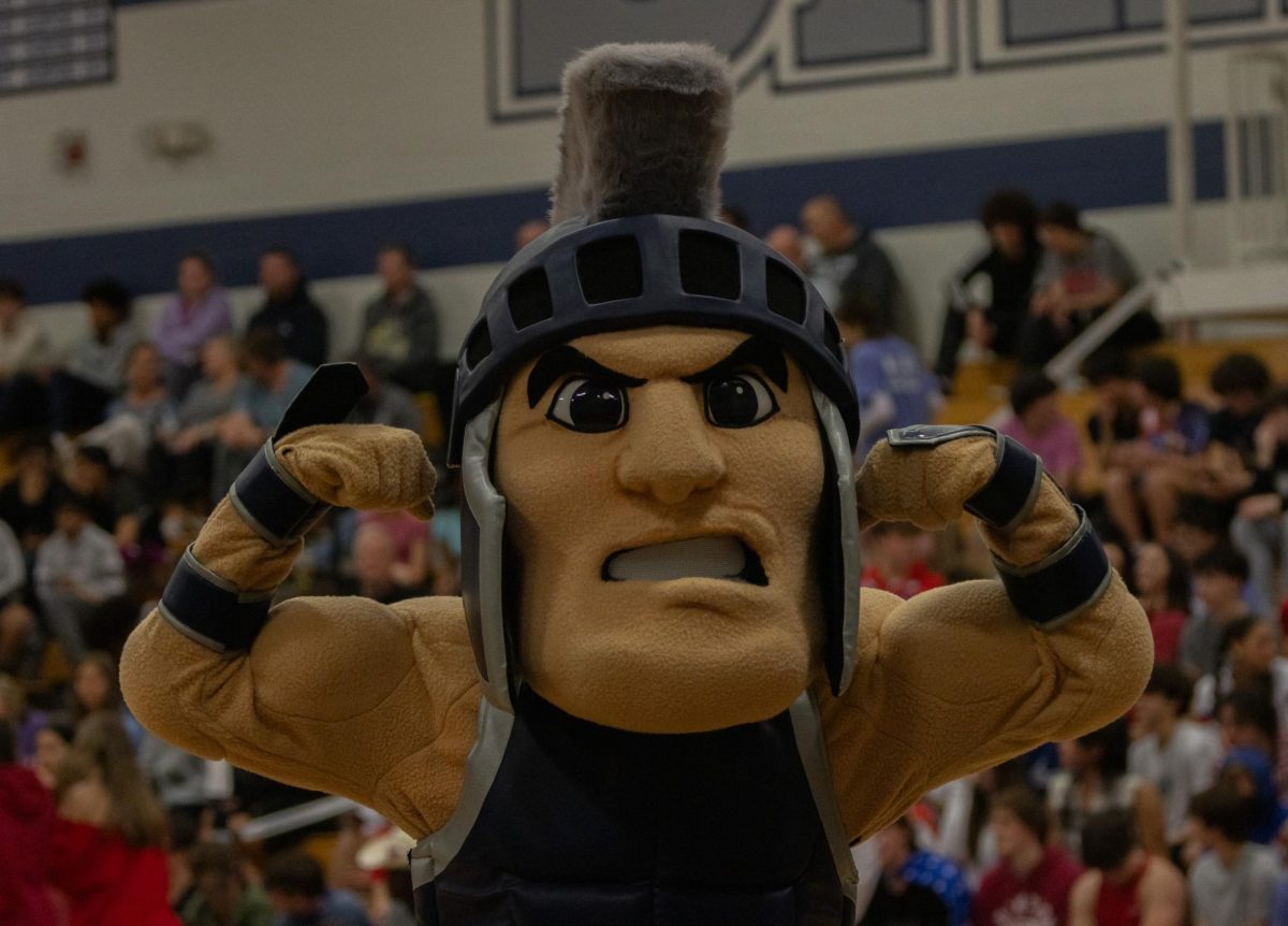 The Spartan mascot, King Leo, flexes for the camera while waiting for halftime to end on March 13 during the senior night game. 