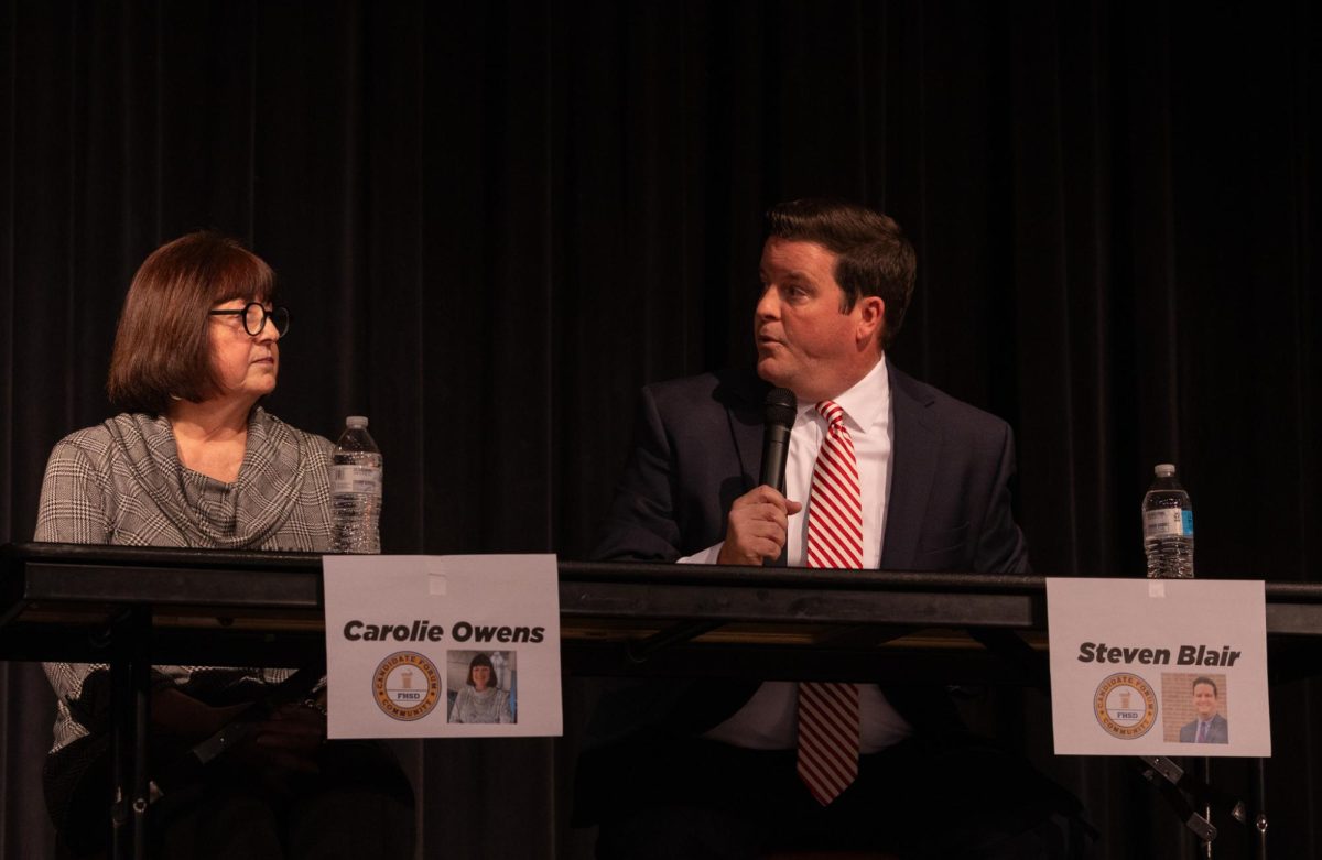 Candidates Carolie Owens and Steven Blair sit on stage as Blair delivers his response to a question. Many questions asked gave candidates a chance to interact with their opponents and compare themselves to the others.