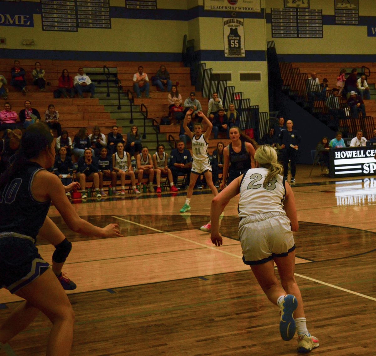 Junior Addie Henderson finds an open lane on the court, and makes a move towards the basket.