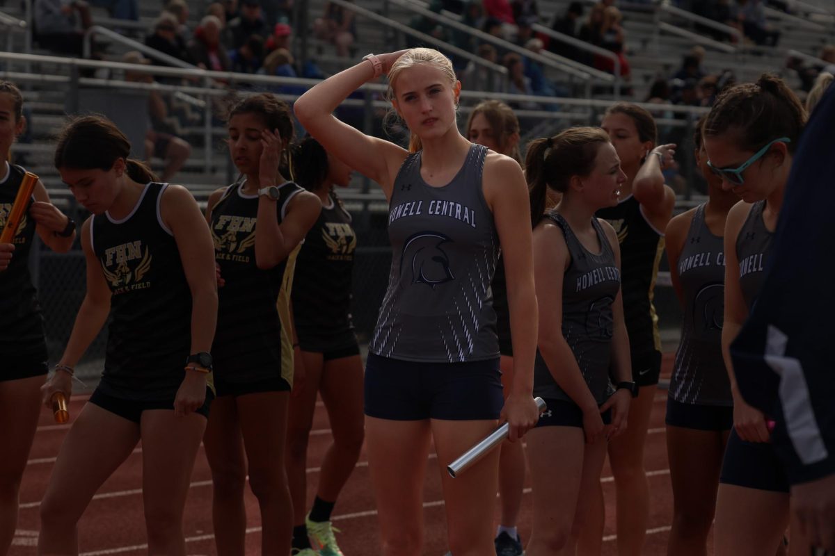 Hannah Halterman holds the baton in her hand, as she focuses in and prepares for her first race of the meet.