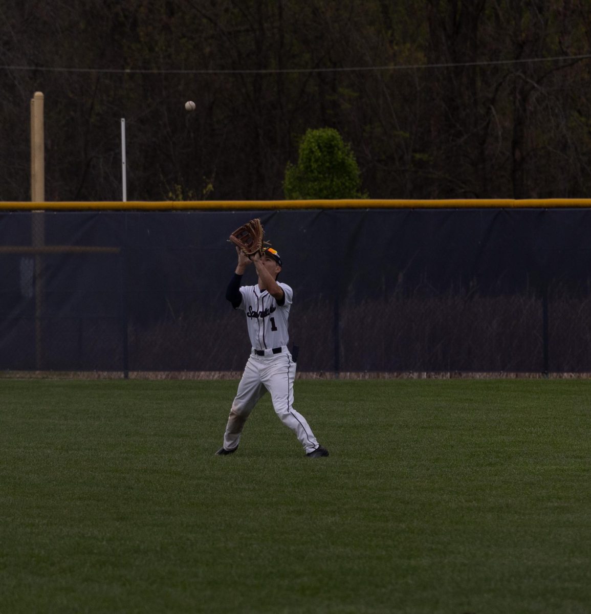 Junior Ethan Callison reads the pop fly and gets under it to catch the ball and make an out.