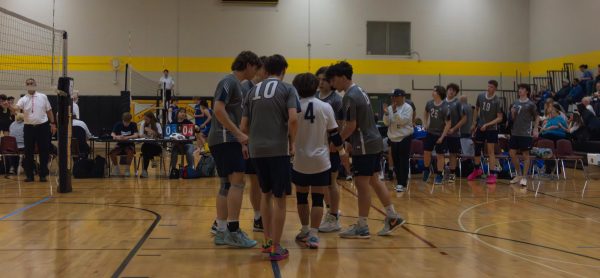 While playing at the varsity Lafayette tournament on April 26. The boys come together in the middle of the court after their point to celebrate.