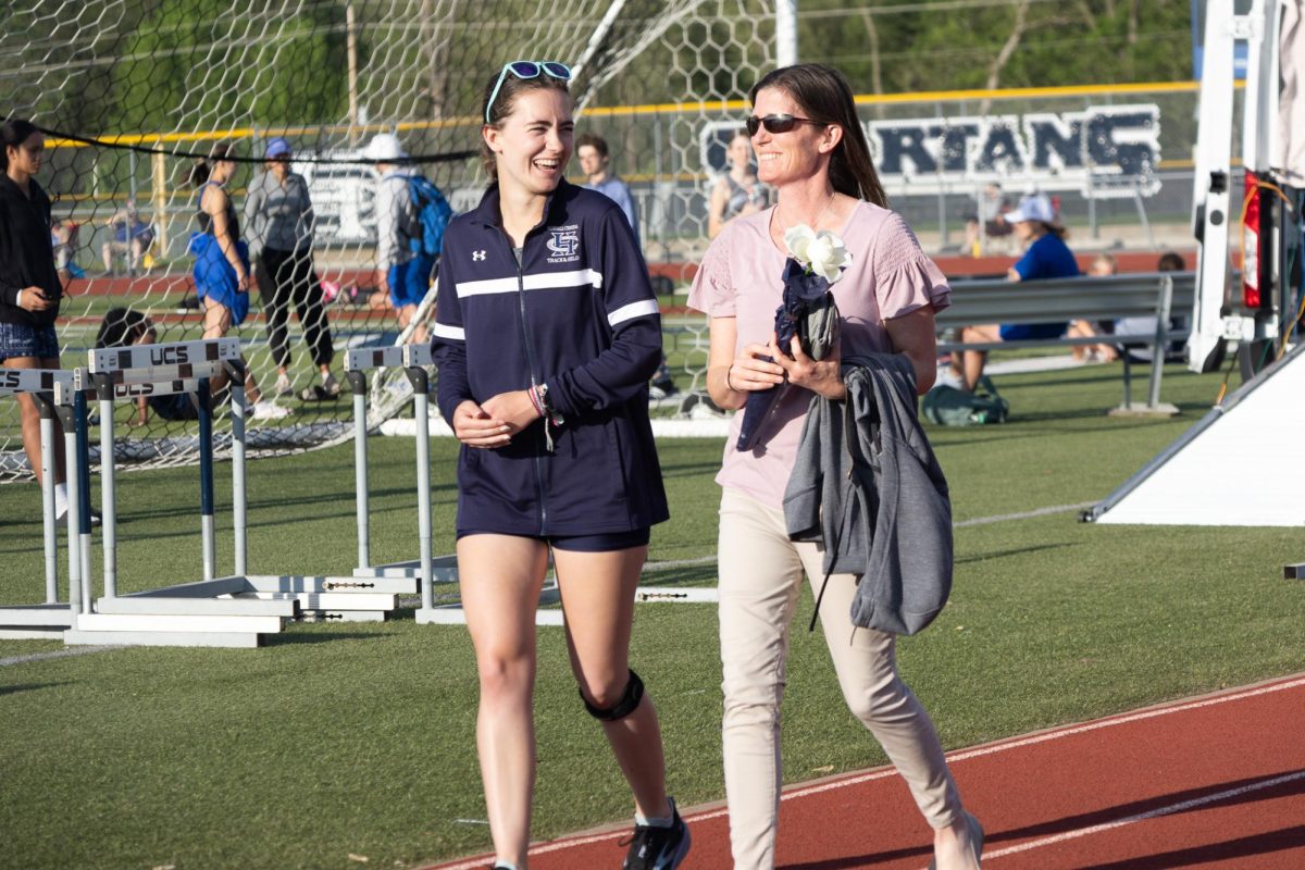 Senior Laney Parmeley smiles to her mom in joy of all that track had brought her.