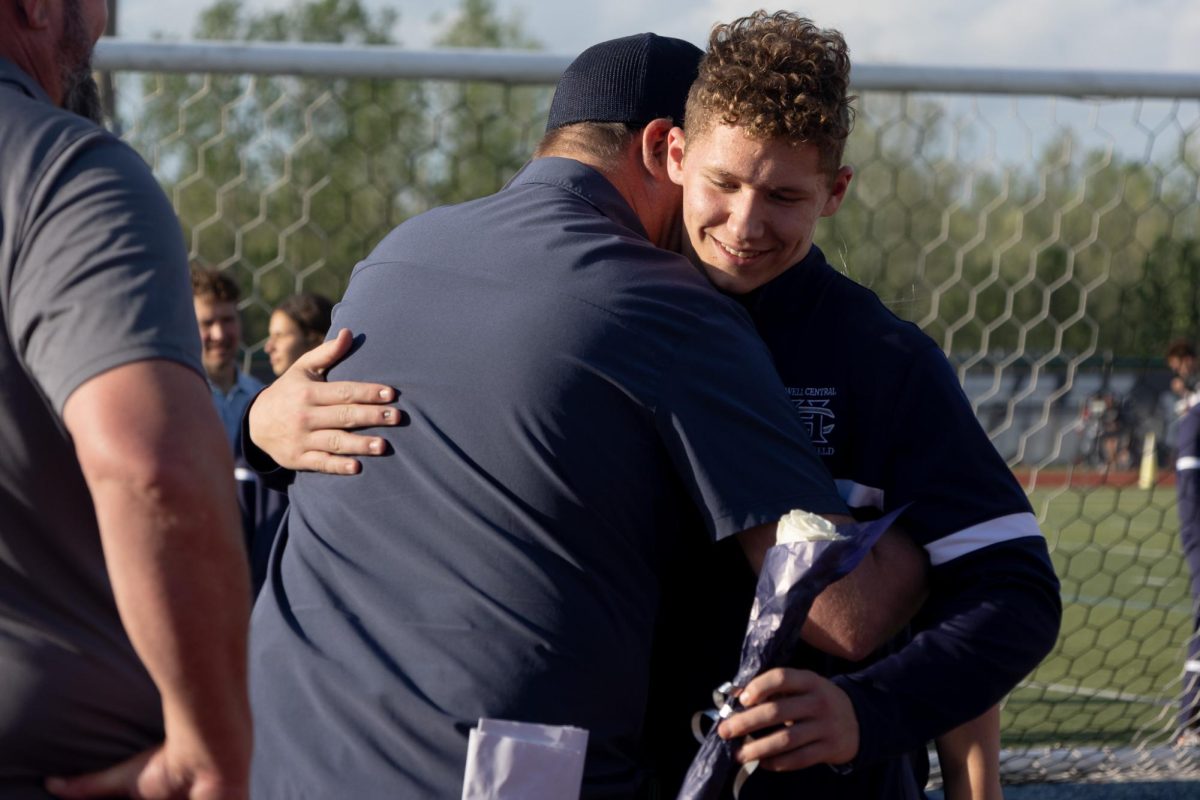 Senior Collin Parsons hugs activities director Scott Harris as a final thank you to him for all hes done. 