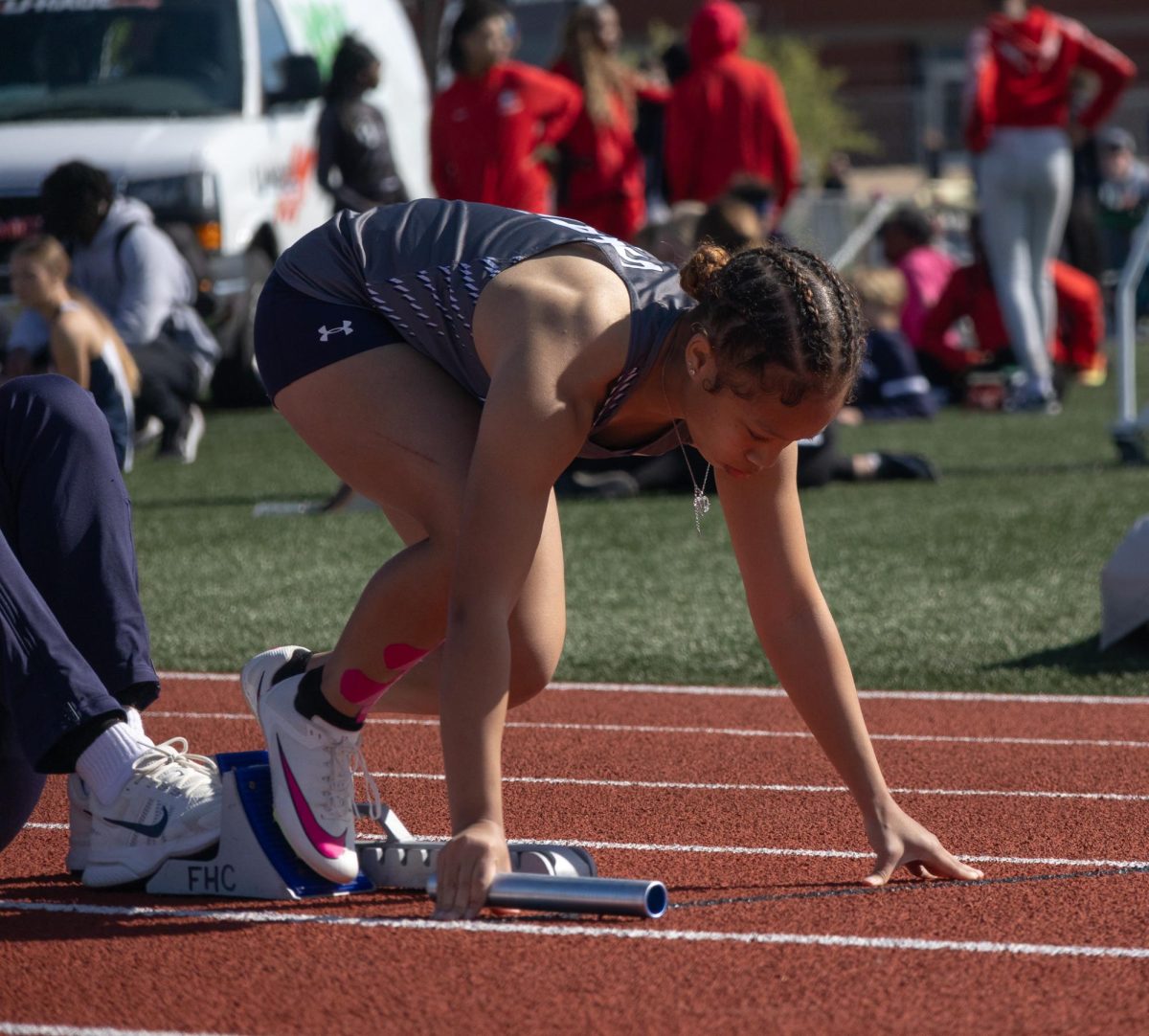 Freshman Taylei Sesson focuses before kicking off her 4x1 race. 