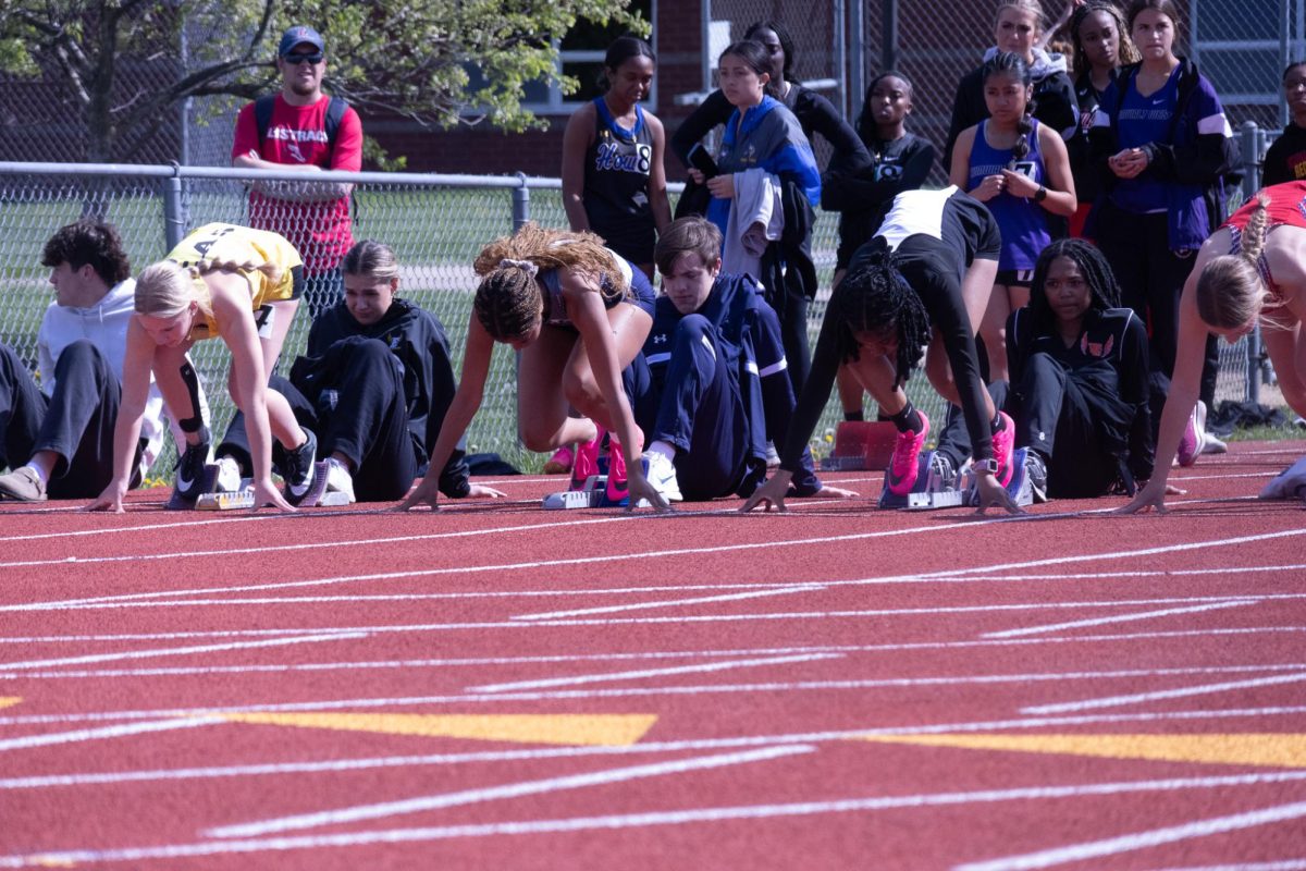 Junior Essence Sebree sits in her blocks anticipating the start of her races 