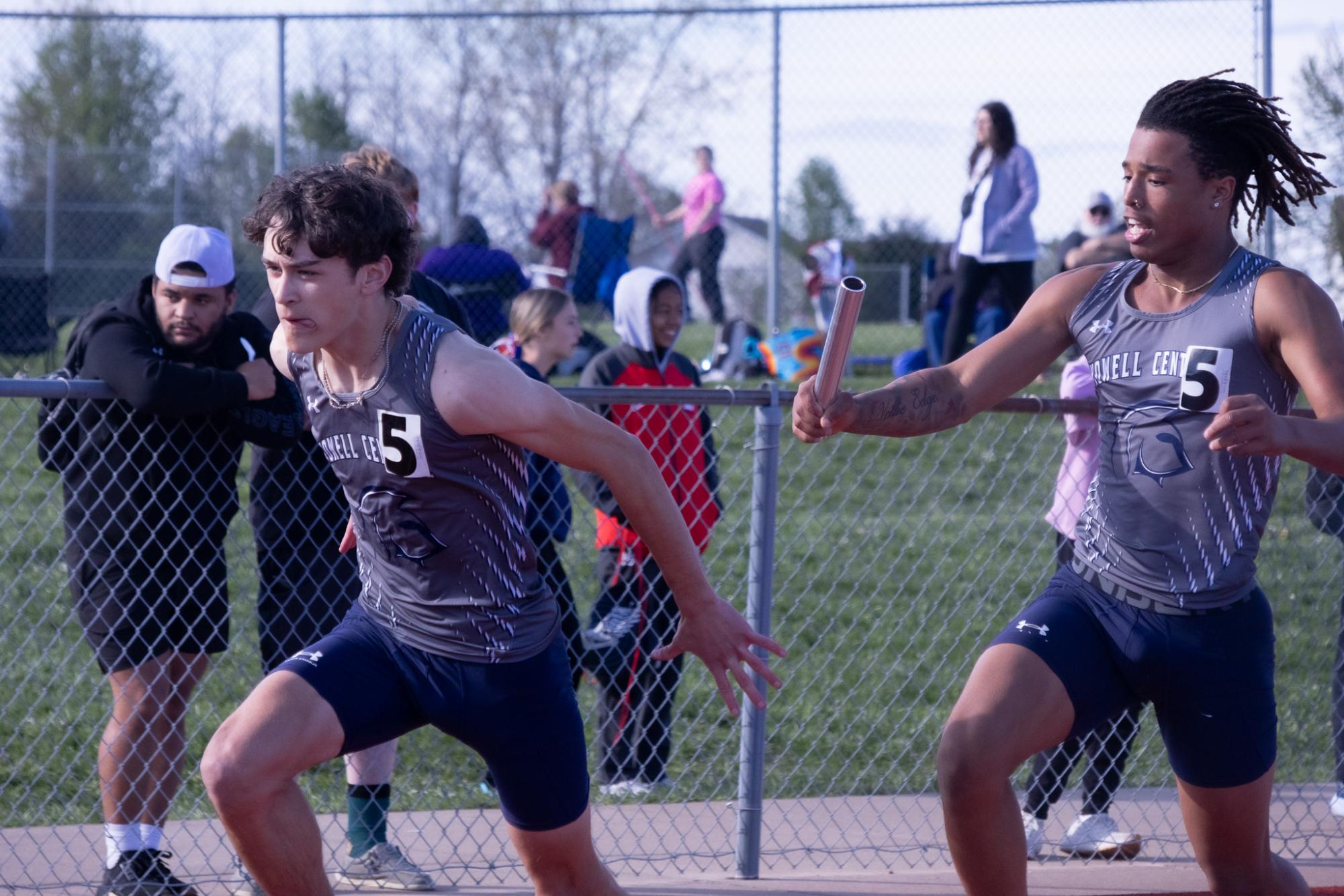 Sophomore Ashton Payton passes the baton to Simeon Smith to proceed in the 4x2.