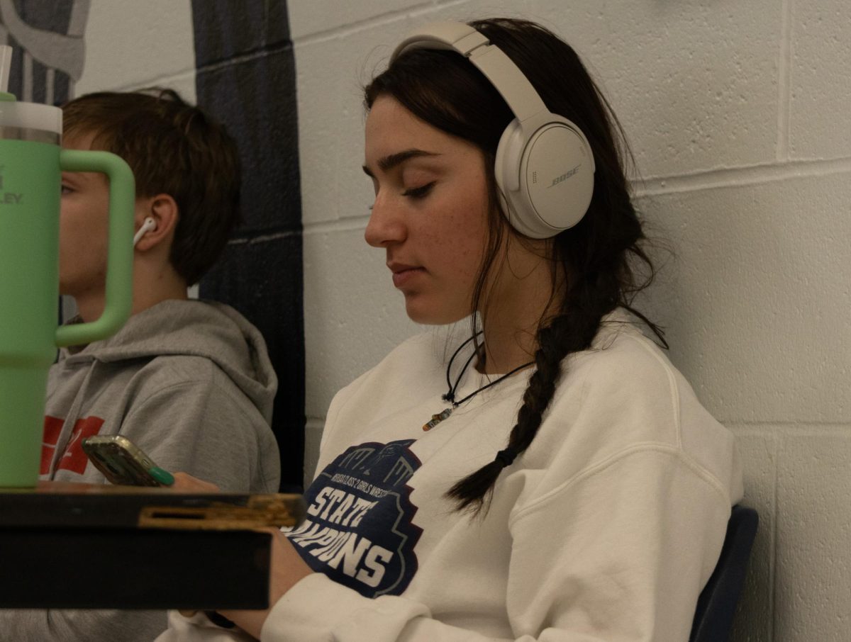 Senior Stevie Lupo listening to music after being done with her work. Everyone listens to music differently. 