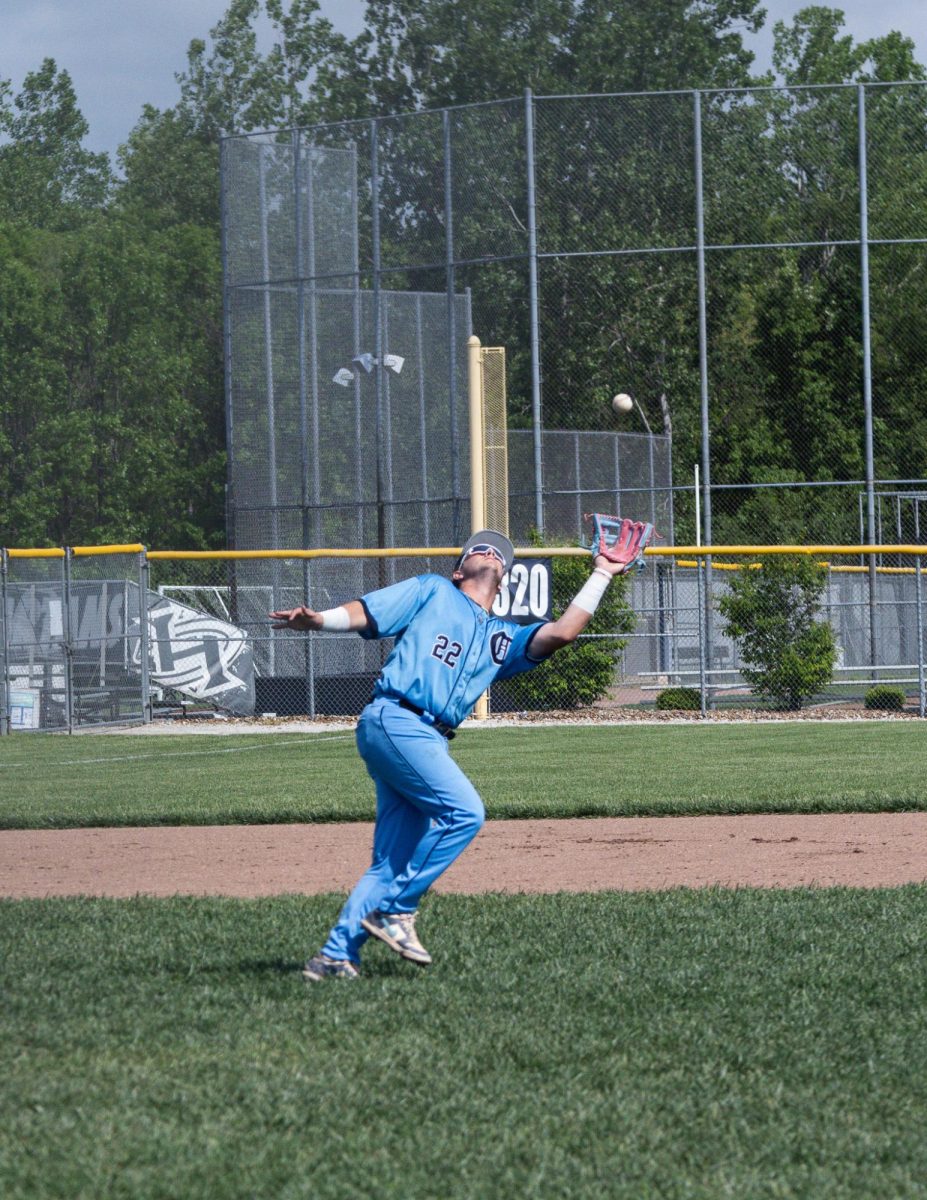 Senior infielder Lucas Pearson catches a ball during the Varsity vs Eureka game on May 4.
