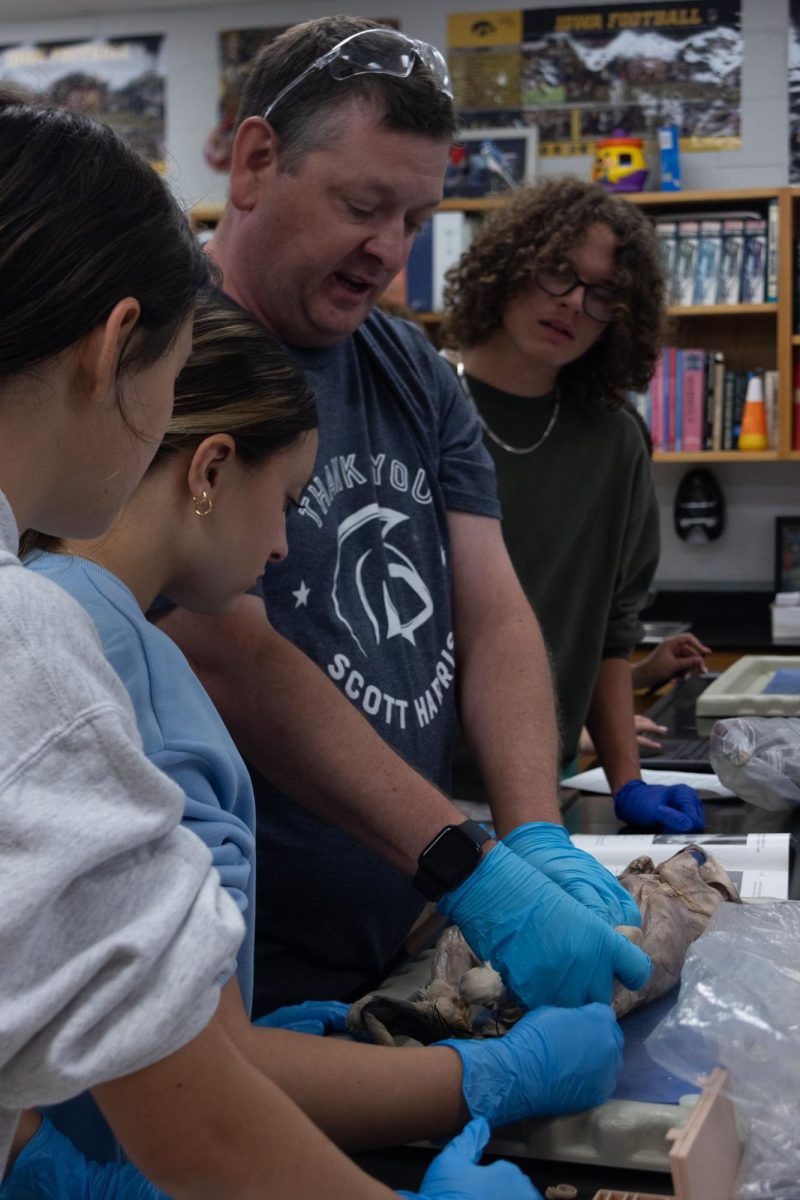 Helping more students, Reed guides this group as they continue in the dissection.