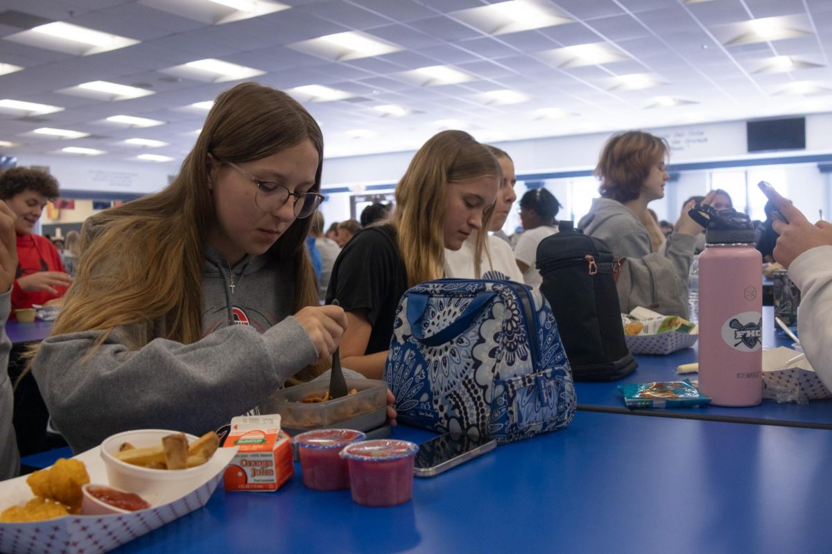Freshman Rachael Latzel skips the one and sits down to start unpacking her homemade lunch, avoiding what she calls the death-dealing lunch at all costs.