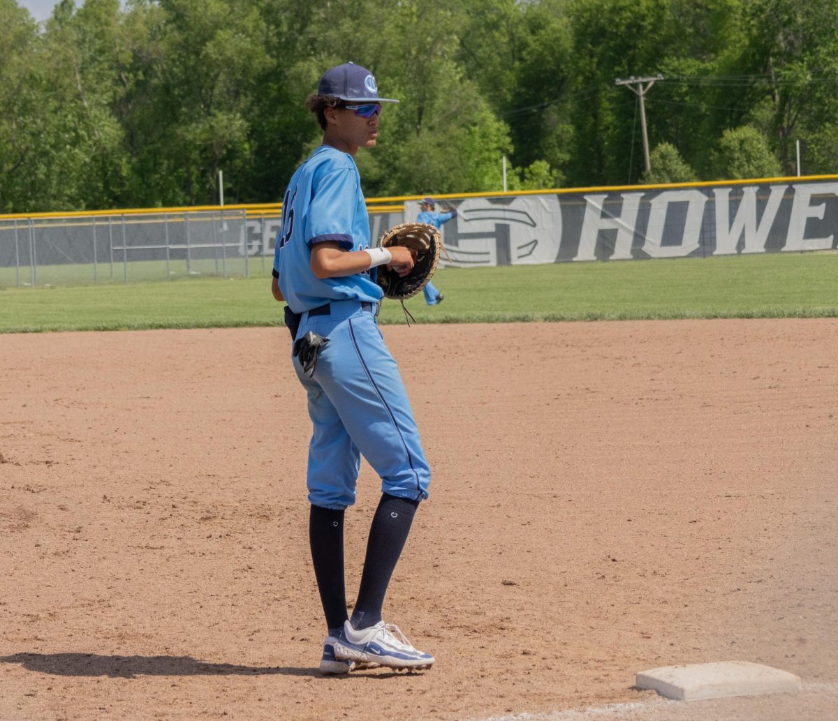 Junior Ethan Leflore looks off to the side of the field in thought  before warming up with his team and passing the ball back and forth on May 4 at the Central vs Eureka game. 