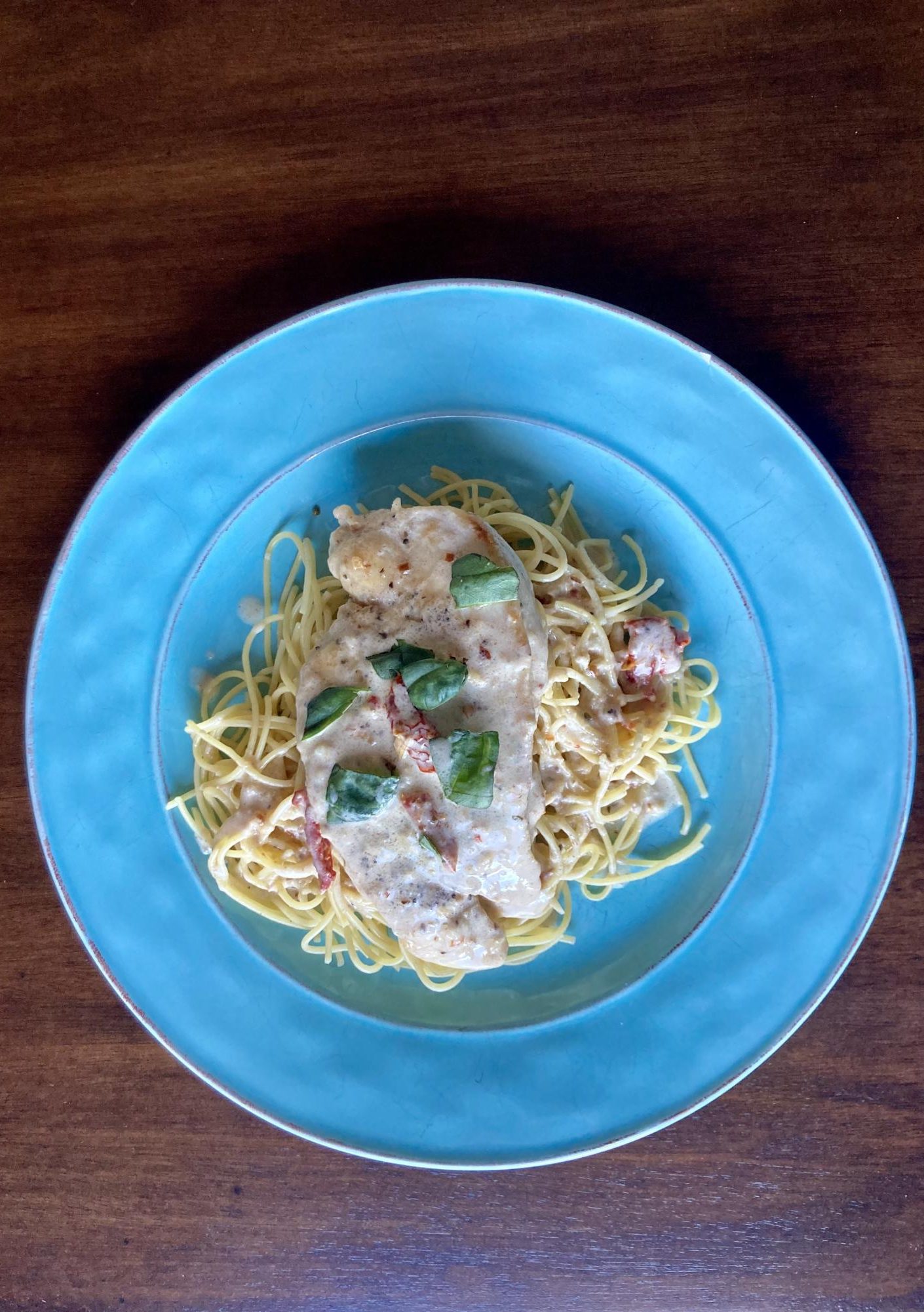 Marry Me chicken with basil over spaghetti. 
