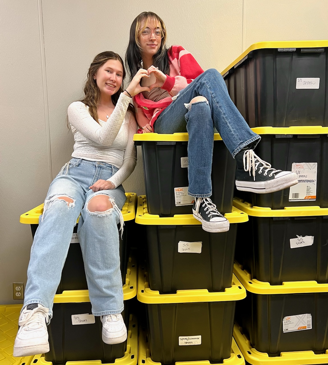 Junior Carrie Byrne [on left] smiles as she finishes up her shift at Hut 8. Carrie has worked at Hut 8 for nearly a year and has enjoyed getting to know her coworkers.