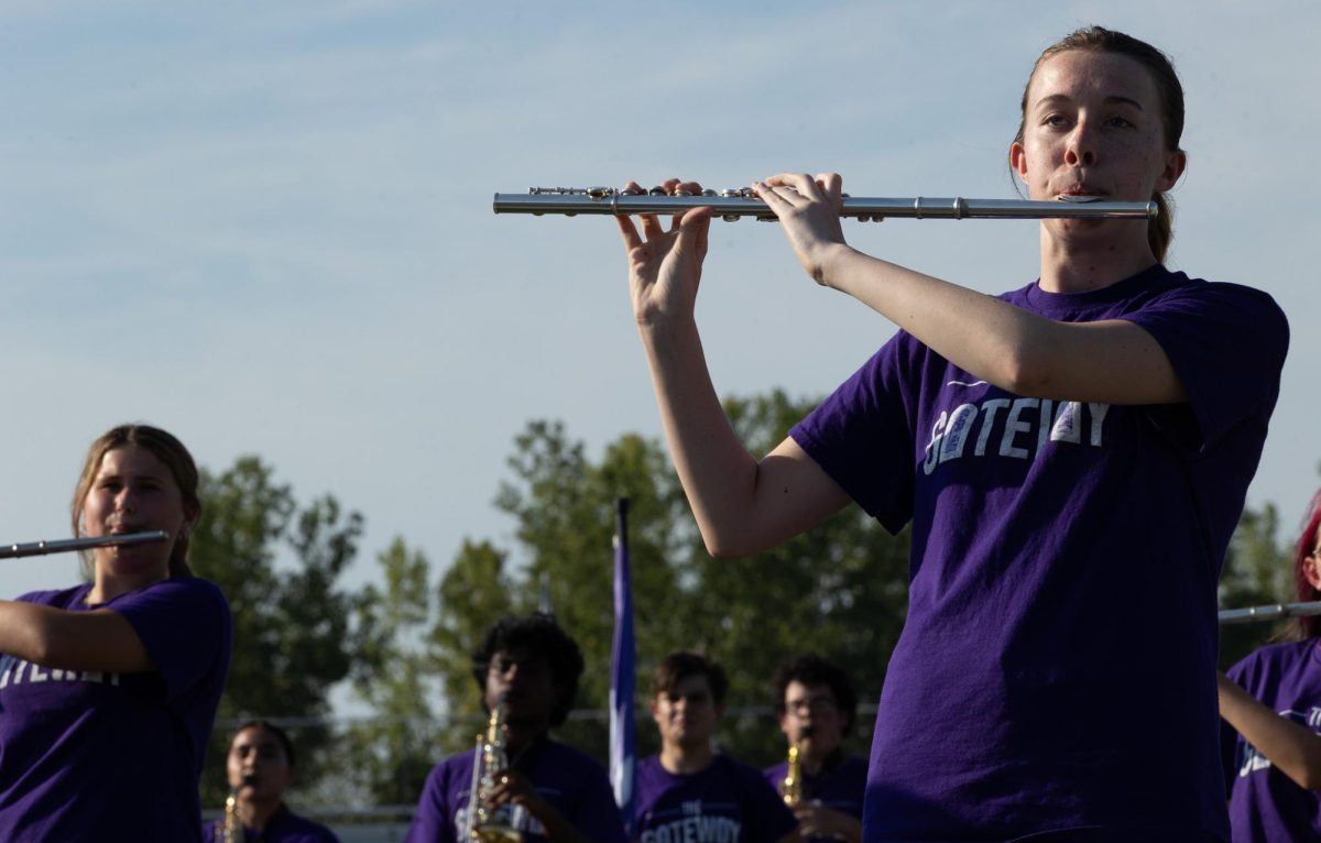 Junior Lillie Taluc plays the flute alongside the rest of the wind instruments. Taluc performed with the marching band and color guard. 