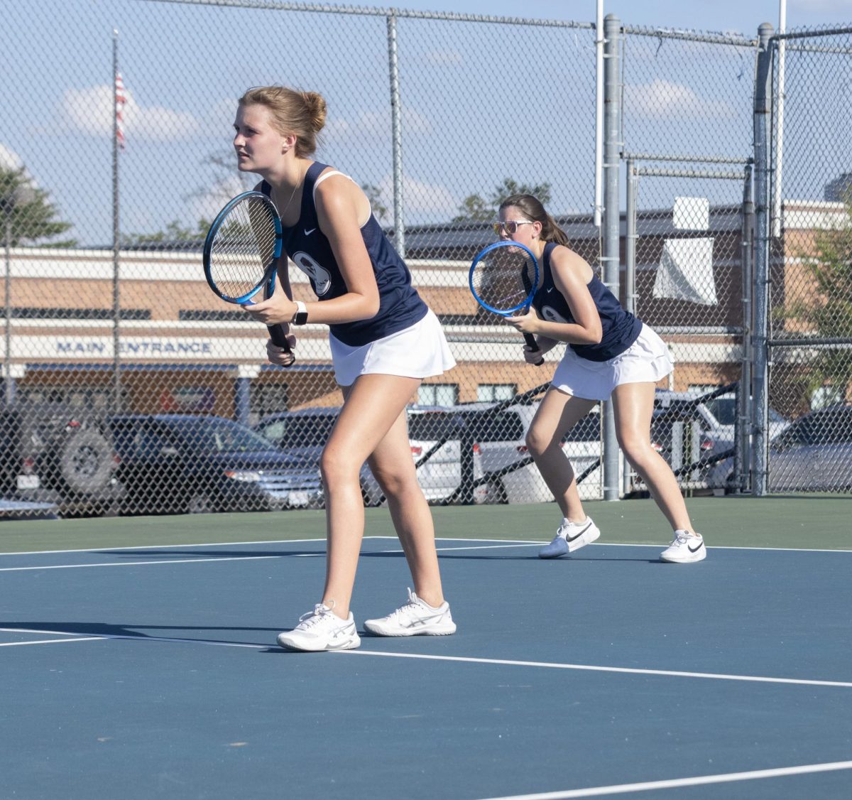 Senior Rylie Schafermeier and Lauren Wortkoetter stand ready in position as the opposing team serves. They await to hit the ball at the match against Helias on Sept. 4, held at Francis Howell Central. Even though they had lost this match Riley had a positive attitude stating “I feel like I did pretty okay in that match. So it really, it was just mainly about how I needed to stay out of my head more.”. Not letting the loss affect her, yet learning from it to help her move forward.