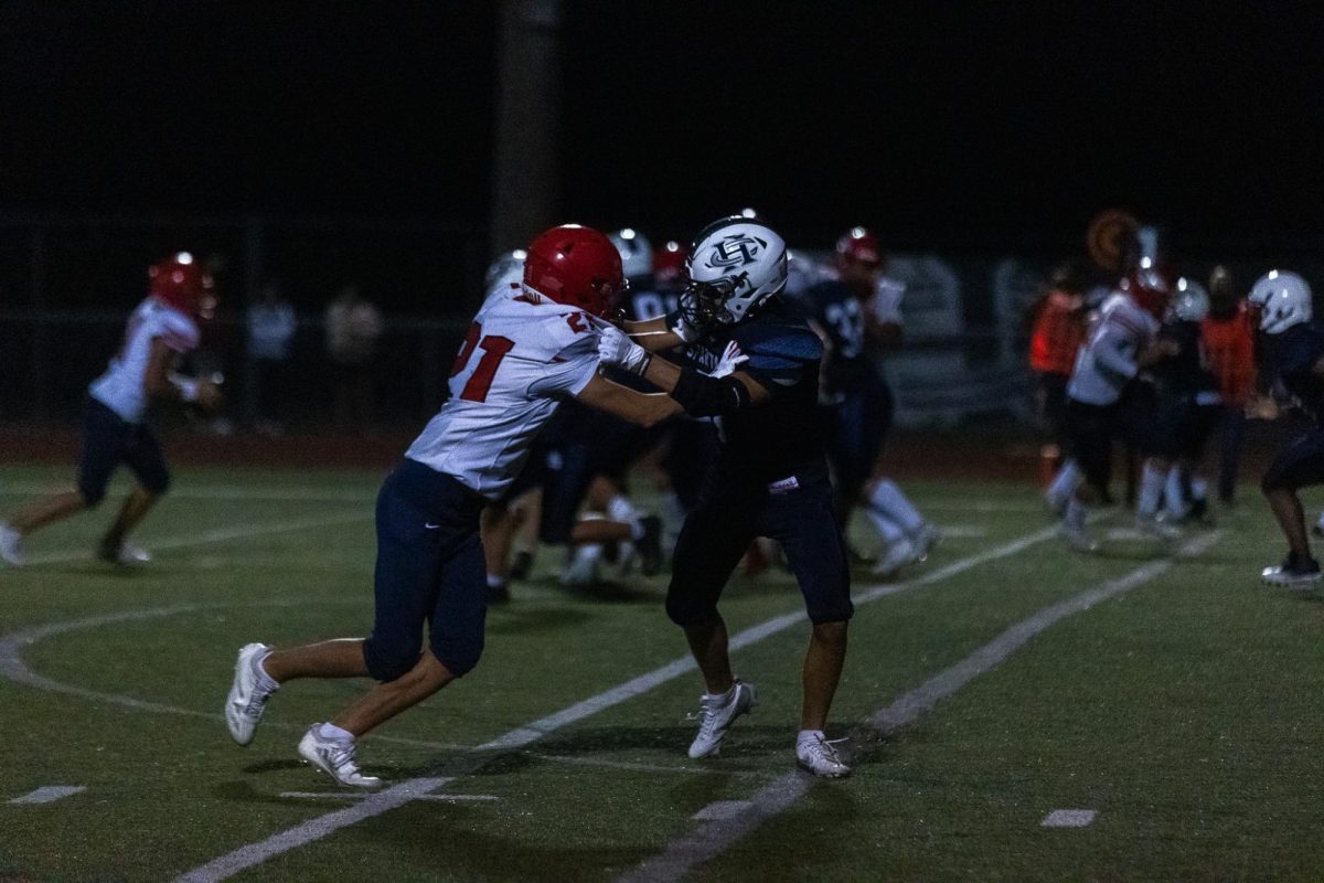 Two players face off against each other, shoving so the other player can’t get the ball. Clashed against each other, the players continue to push until the whistle is blown. 