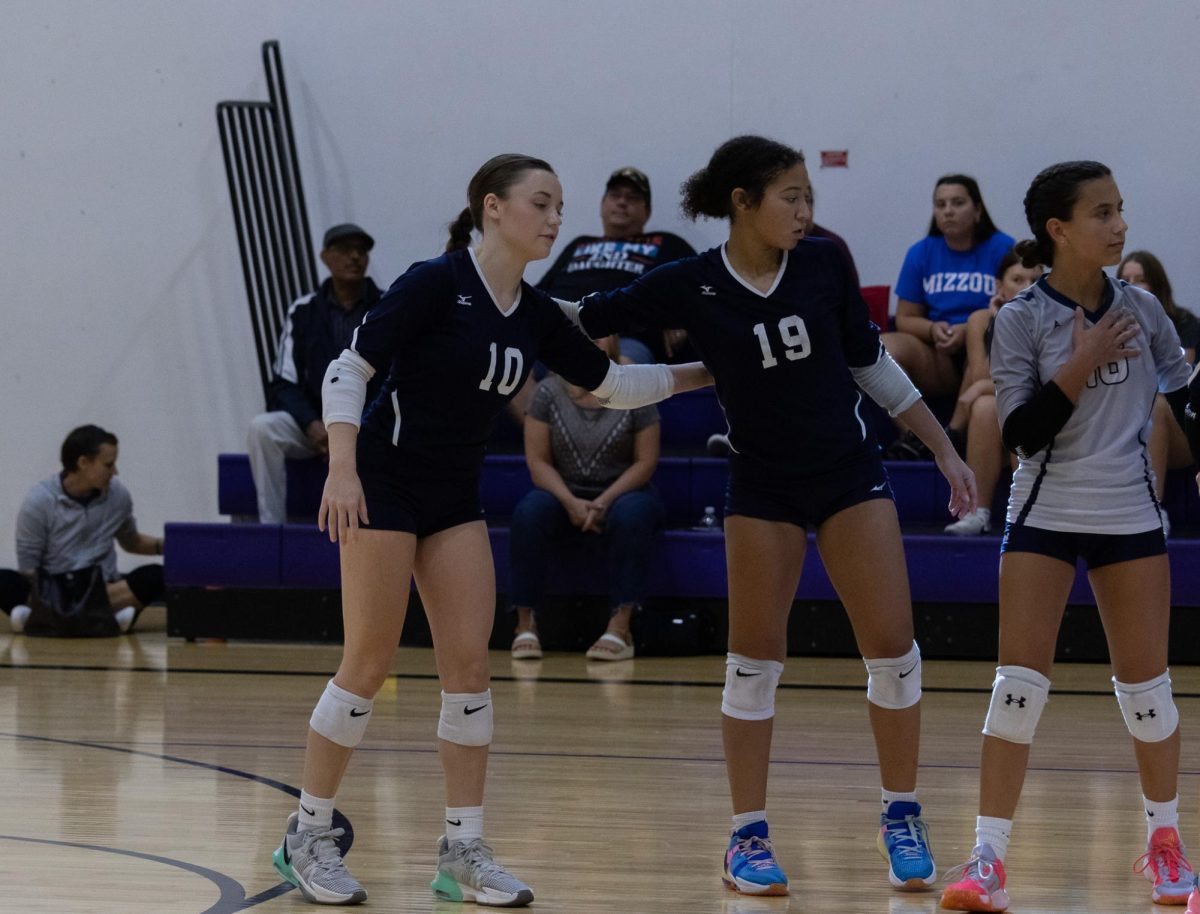 Lydia Beffa and Hayley Vineyard stand in their positions, holding on to each other. Beffa and Vineyard were waiting for their opponent to serve the ball. 