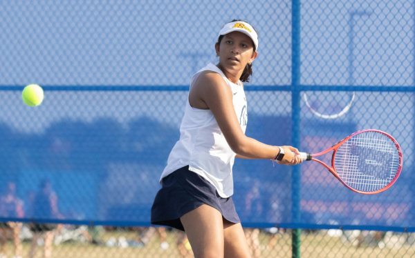 Sophomore Sivani Kandel tracks the tennis ball as she warms up for her doubles match against North Point. Kandel had been playing consistantly all season, which allowed her to play higher junior varsity doubles teams every game.