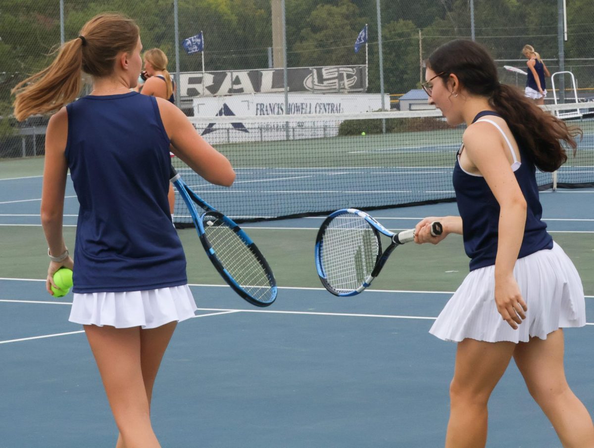 Seniors and good friends, Nadia Manuchev and Rylie Schaefermeier, tap their racquets after a double match against Troy. Tapping racquets after a play is a way of saying “good job” or “keep it up” to encourage and motivate your teammates.